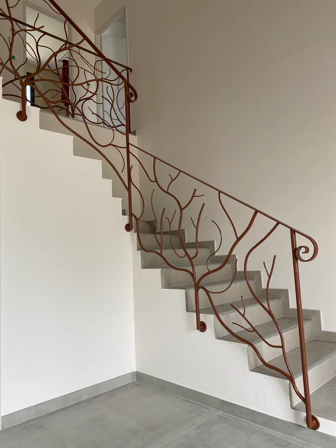 Rampe d'escalier en fer forgé, L'Art de Faire
