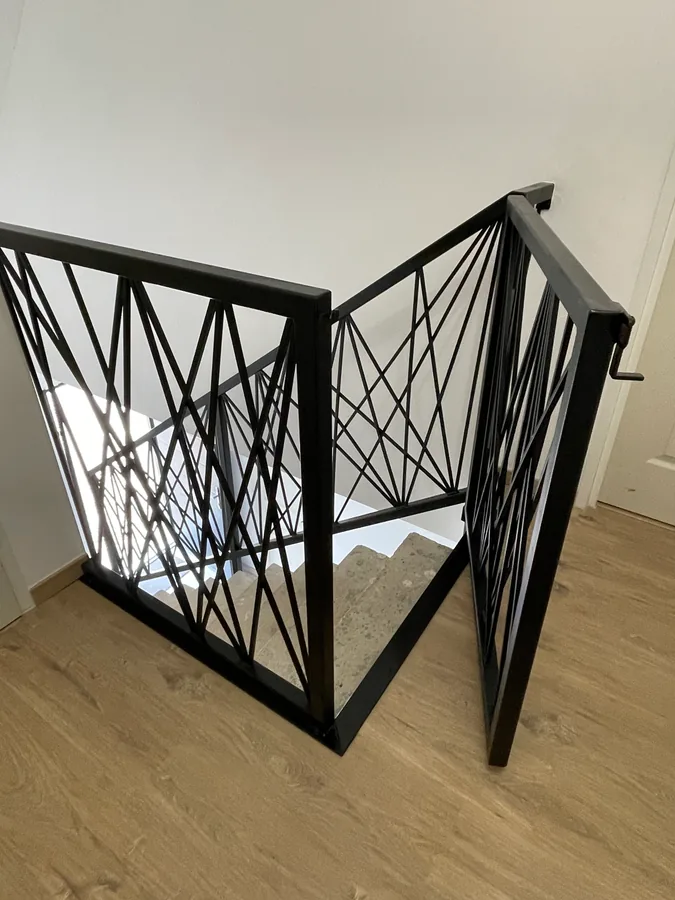 Rampe d'escalier en fer forgé à barreaux, L'Art de Faire